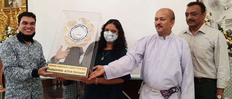 Mr. Ashley Afonso and Mrs. Raisa Fernandes with the rolling trophy