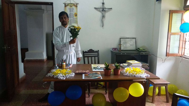 Our pastor at his desk