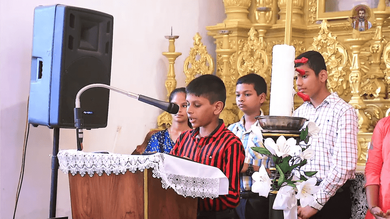 The altar servers reciting the Prayers of the Faithful