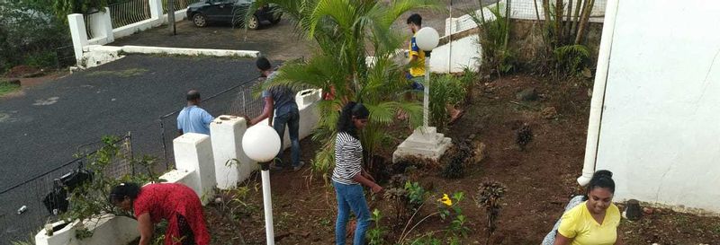 The parishioners working in the garden